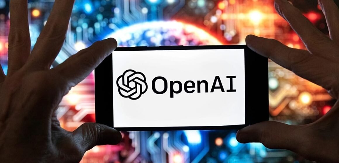 OpenAI logosu ve yapay zeka sohbet arayüzü görülen bir ofis sahnesi